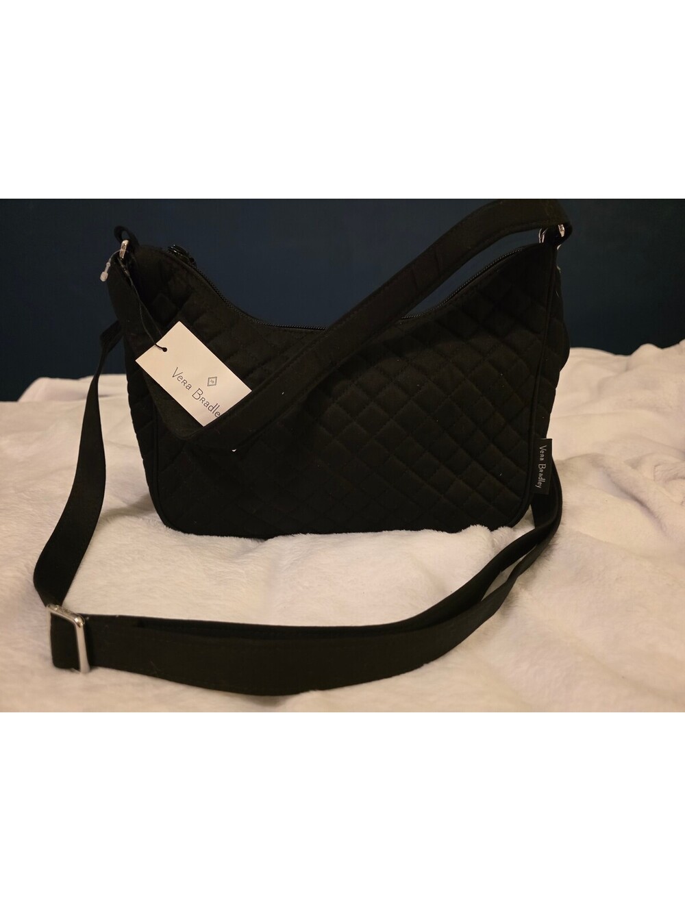 Black quilted crescent crossbody bag